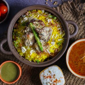 Top view of authentic biryani with accompaniments, a visual feast.